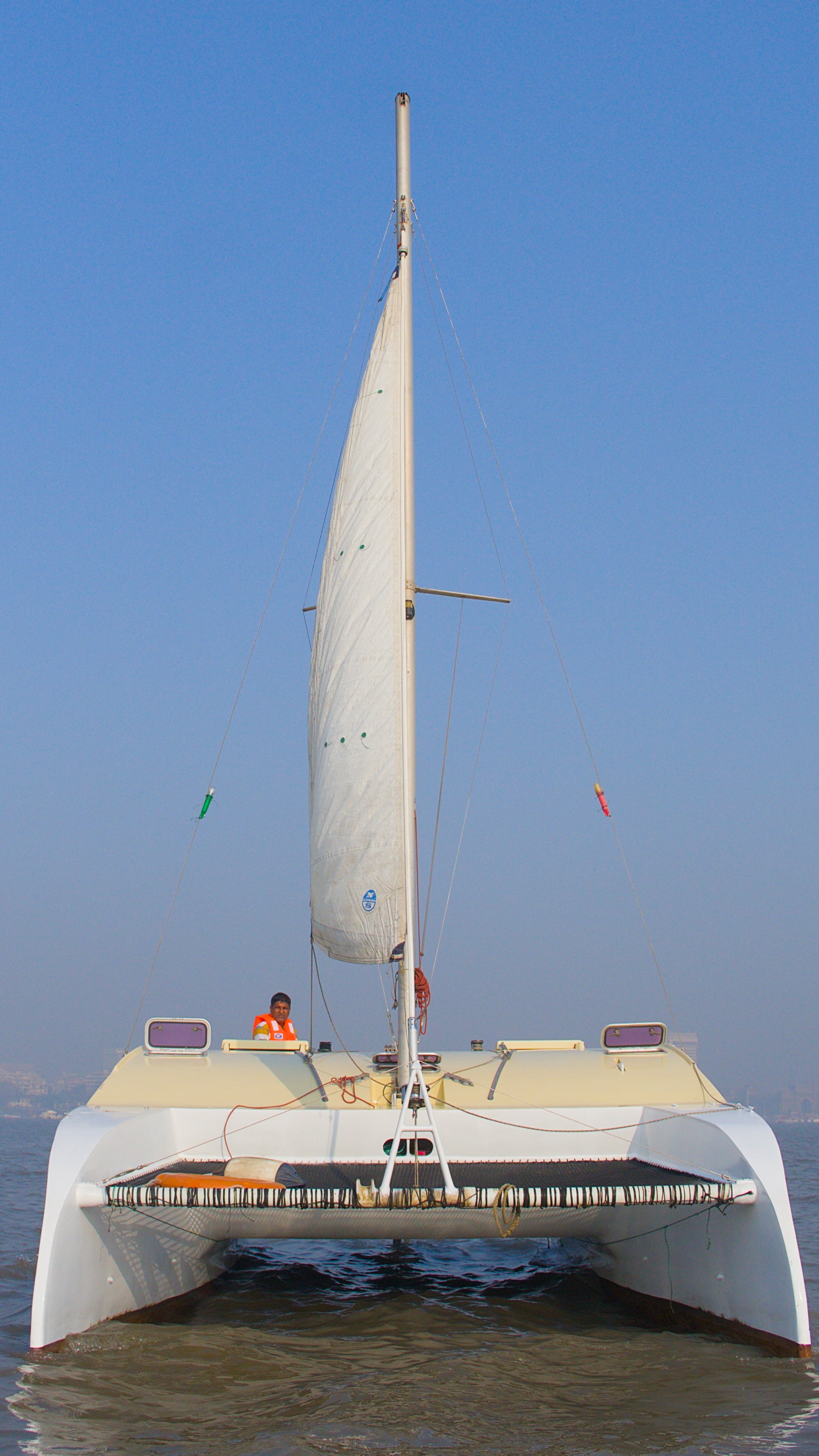 Sailboat on water with clear blue sky