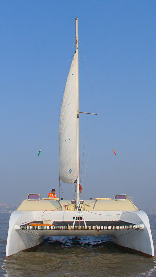 Sailboat on water with clear blue sky